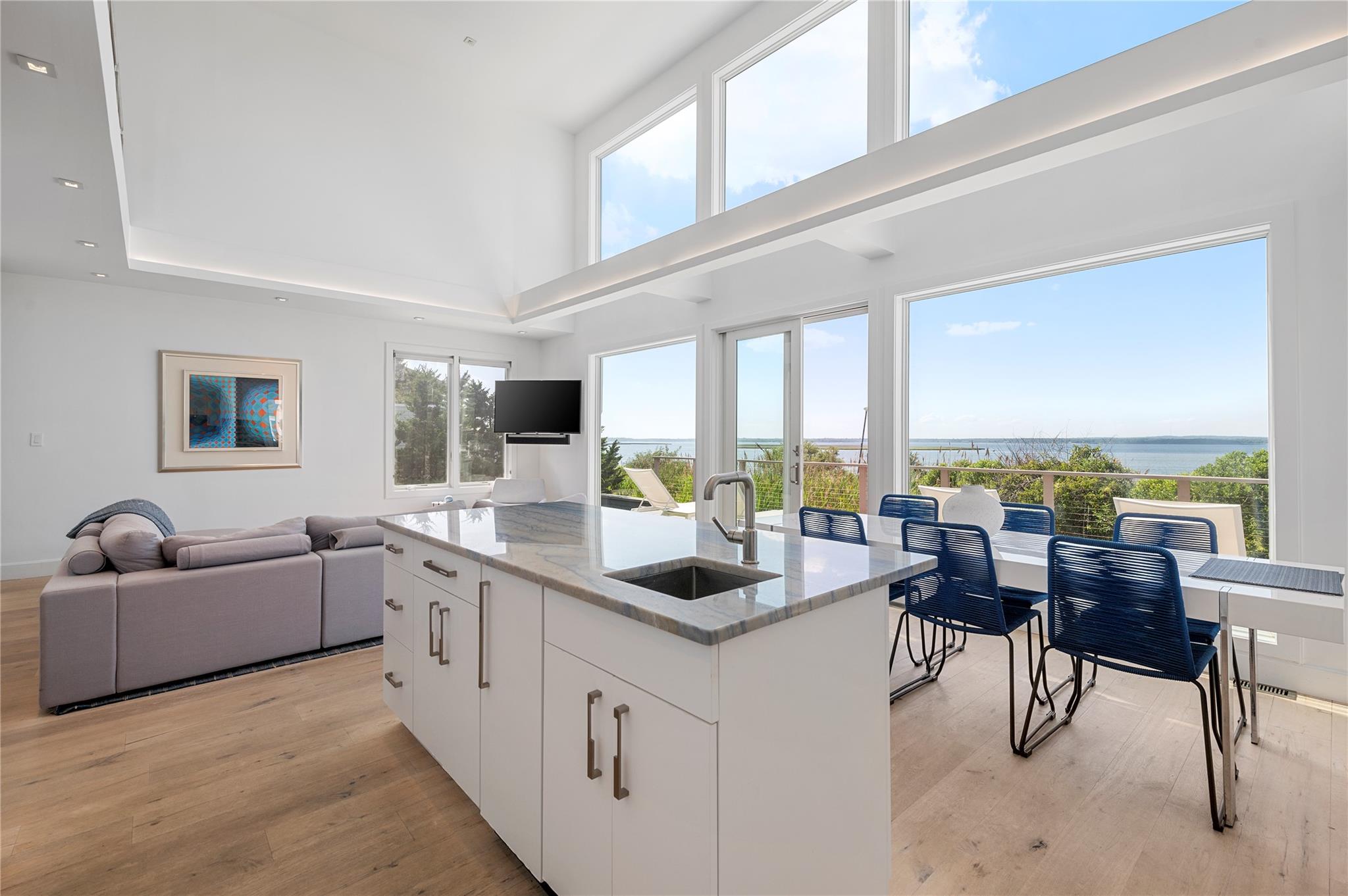 846 Dune Road West Hampton Dunes, NY 11978 - Photo 48 of 49 a living room with furniture a large window and a view of living room