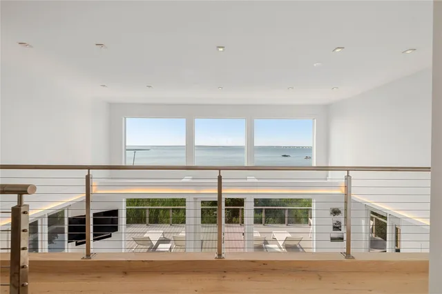 a large kitchen with kitchen island a dining table and chairs