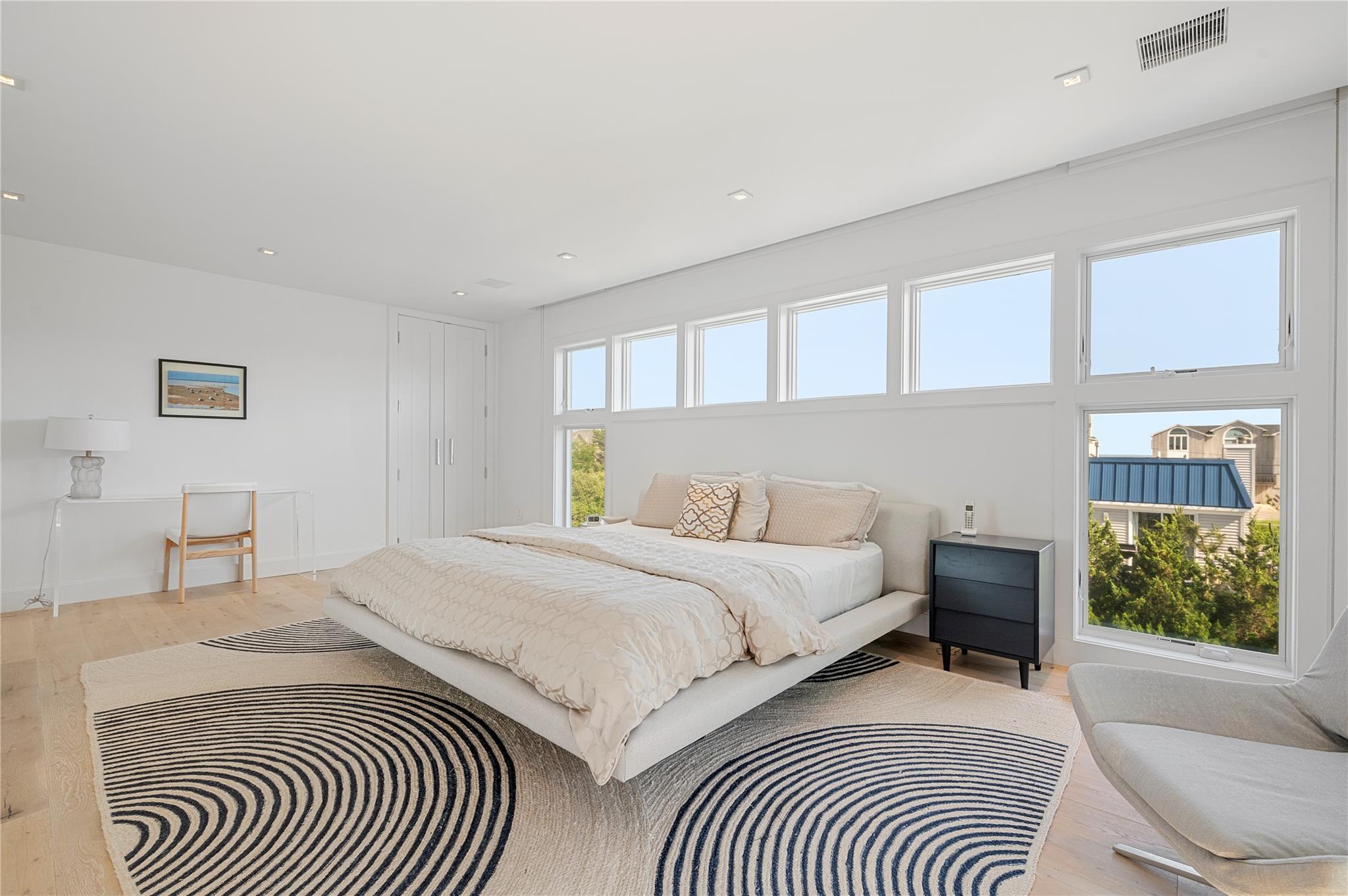 846 Dune Road West Hampton Dunes, NY 11978 - Photo 18 of 49 a bedroom with a bed and a window