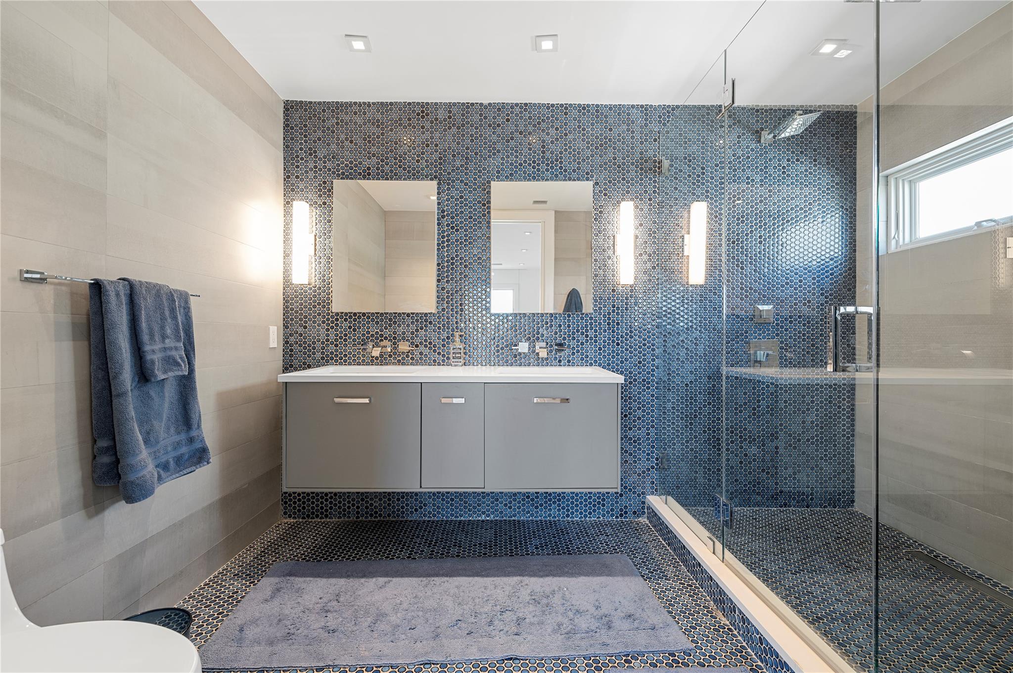 846 Dune Road West Hampton Dunes, NY 11978 - Photo 20 of 49 a bathroom with a sink a toilet and shower