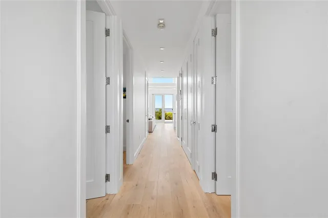 a view of a roof deck with couches and sky view