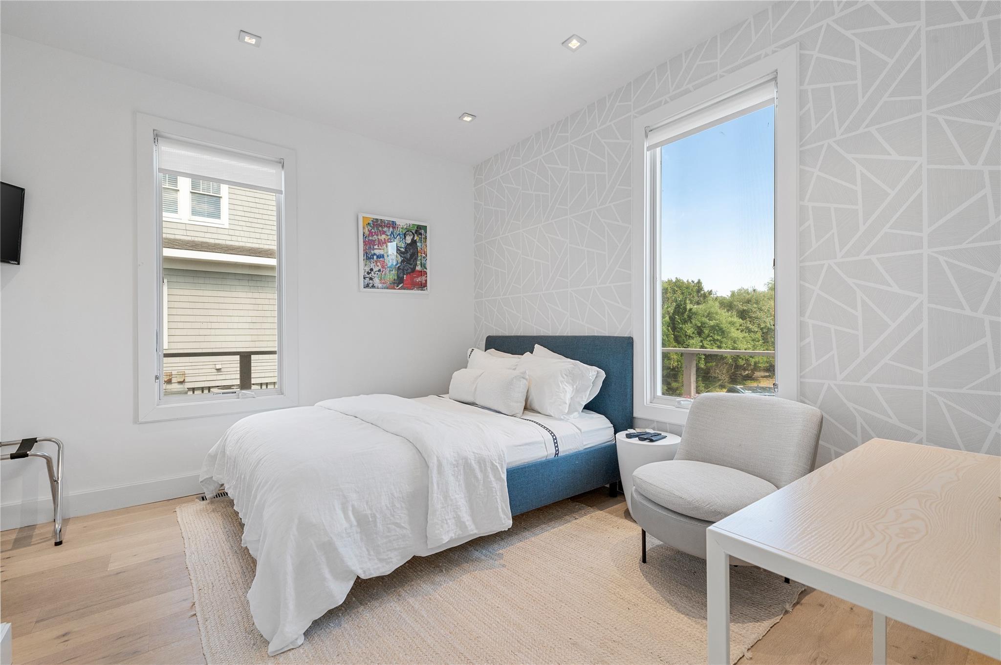 846 Dune Road West Hampton Dunes, NY 11978 - Photo 29 of 49 a bedroom with a bed and a couch