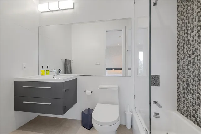 a bedroom with a bed and a couch