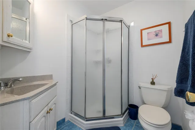 a bedroom with two beds and a window