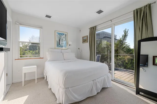 a bathroom with a toilet a sink and shower