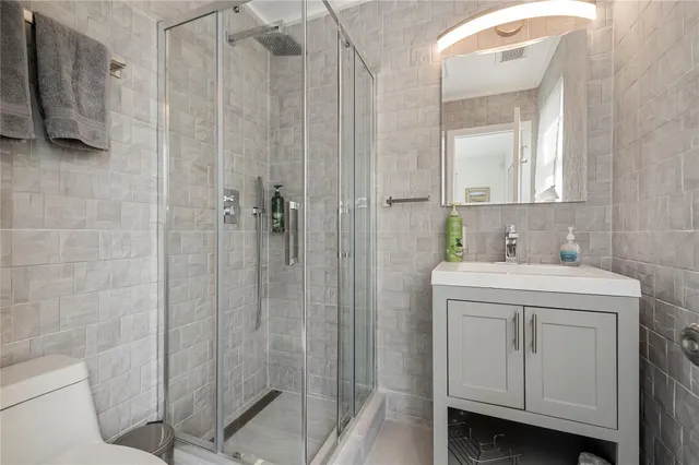 a bedroom with a large bed and a large window