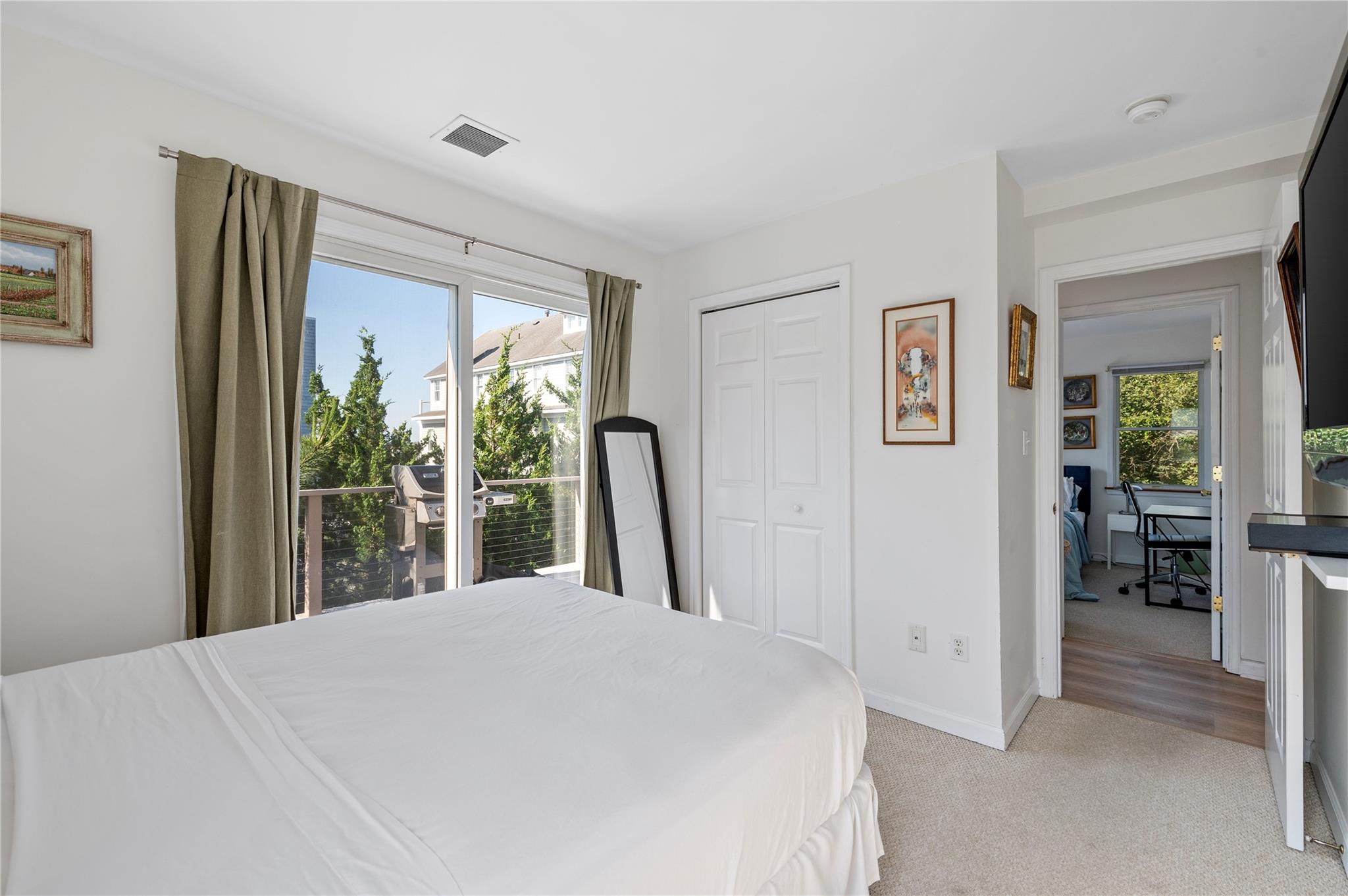 846 Dune Road West Hampton Dunes, NY 11978 - Photo 42 of 49 a bed sitting in a bedroom next to a window