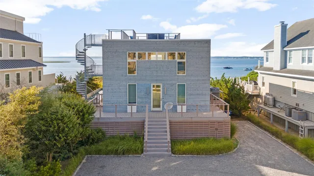 a view of a brick building next to a yard