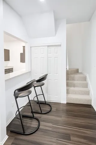 a view of staircase with white walls