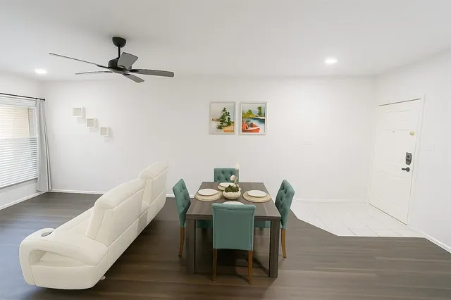 a hallway with a table and a couch