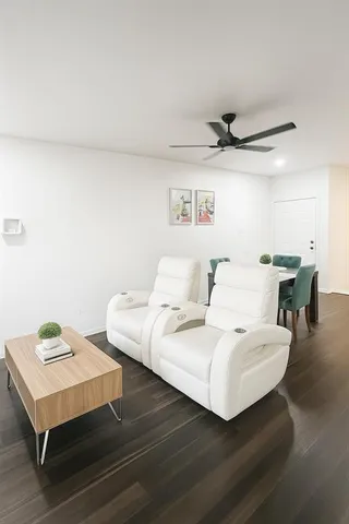 a living room with furniture and a table