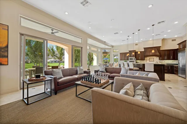 a kitchen with granite countertop a sink a stove and cabinets
