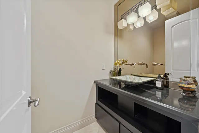 a bedroom with a bed couch and a large window