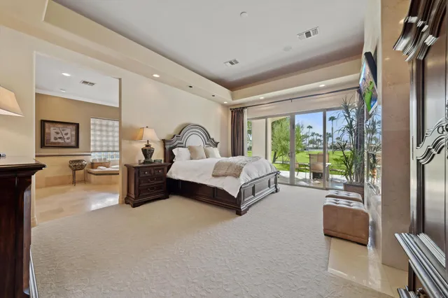 a bed room with a bed and a chair