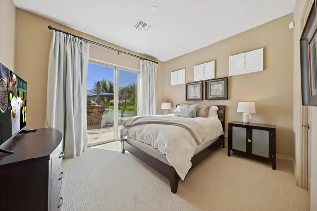 a bathroom with a double vanity sink mirror and shower