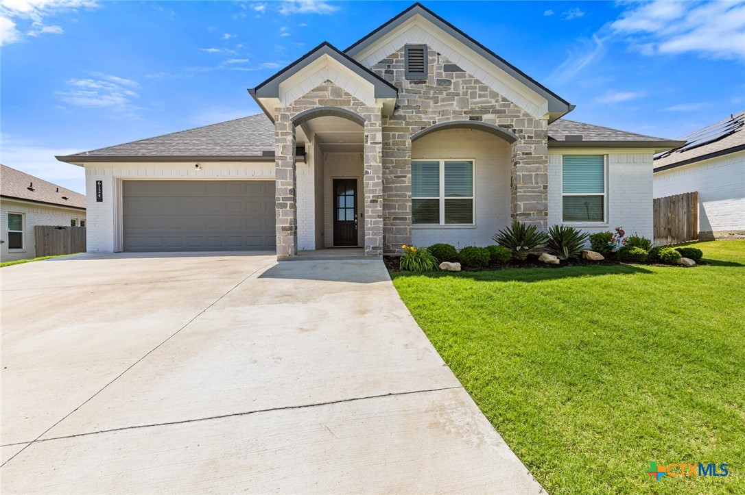 6124 Monza Drive Temple, TX 76502 - Photo 1 of 1 a front view of a house with a yard and garage