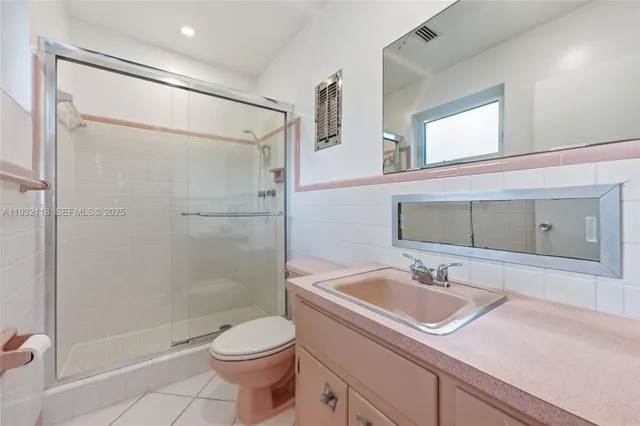 a bed room with a bed and a window