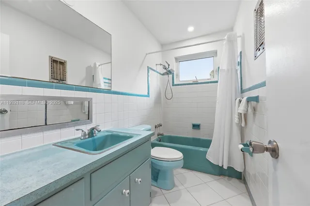 a bed room with a bed and a couch