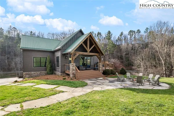 a view of a swimming pool with a yard