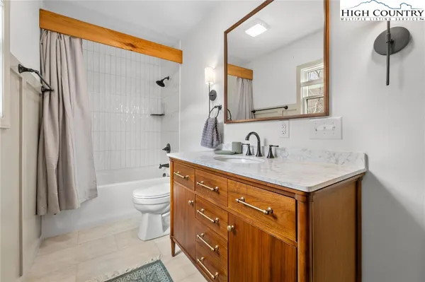 a bedroom with a large bed and a large window