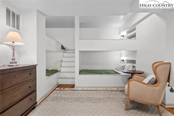 a spacious bedroom with a bed and a couch