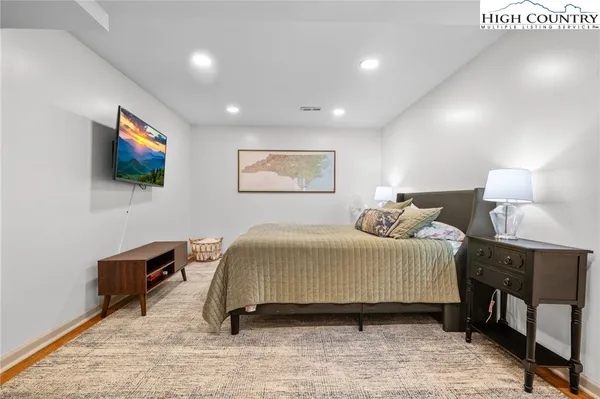a view of a roof deck with couches and sky view