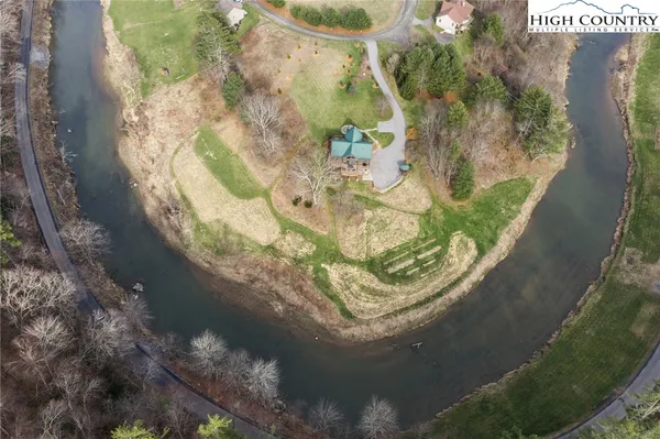 a view of a house with a yard porch and sitting area