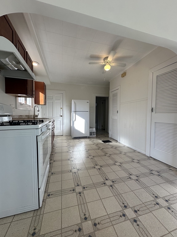 39 Thorndike Street, Unit 1 Beverly, MA 01915 - Photo 2 of 6 a view of open kitchen with a sink and dishwasher kitchen view