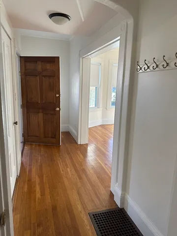 a view of a room with wooden floor and closet
