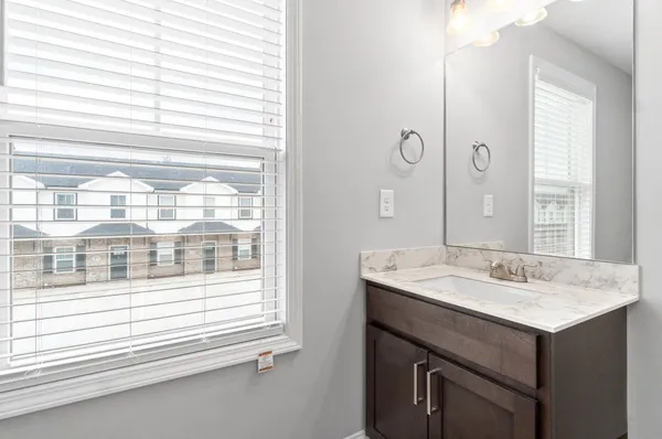a bathroom with a sink and a mirror