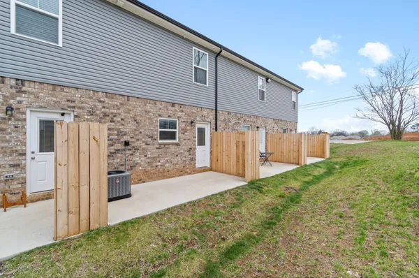 a view of a back yard of the house
