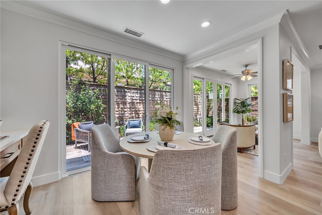 55 Open Range Irvine, CA 92602 - Photo 16 of 66 a dining room with furniture and wooden floor