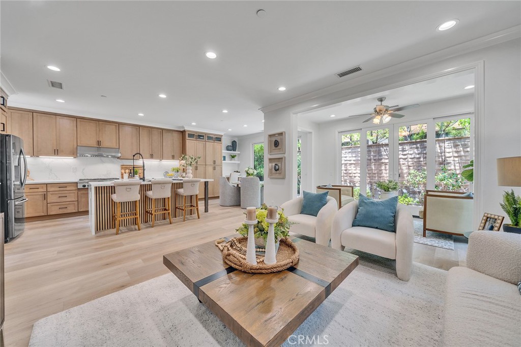 55 Open Range Irvine, CA 92602 - Photo 23 of 66 a living room with furniture kitchen and a large window