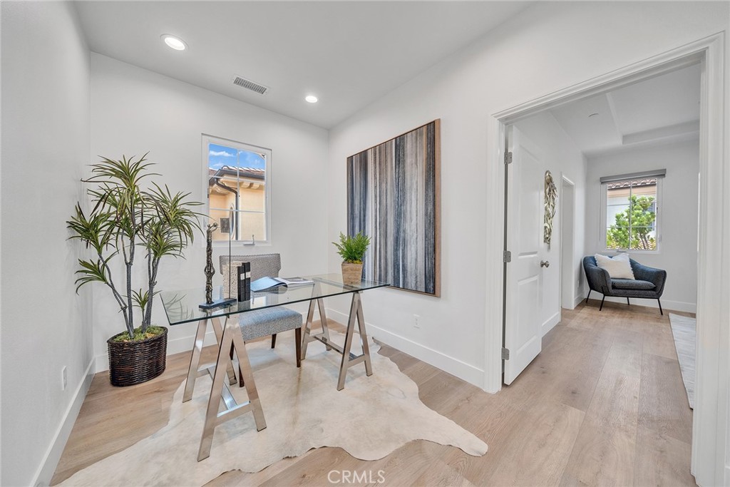 55 Open Range Irvine, CA 92602 - Photo 24 of 66 a living room with furniture a potted plant and a table