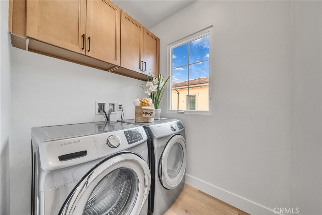 55 Open Range Irvine, CA 92602 - Photo 25 of 66 a utility room with dryer and washer
