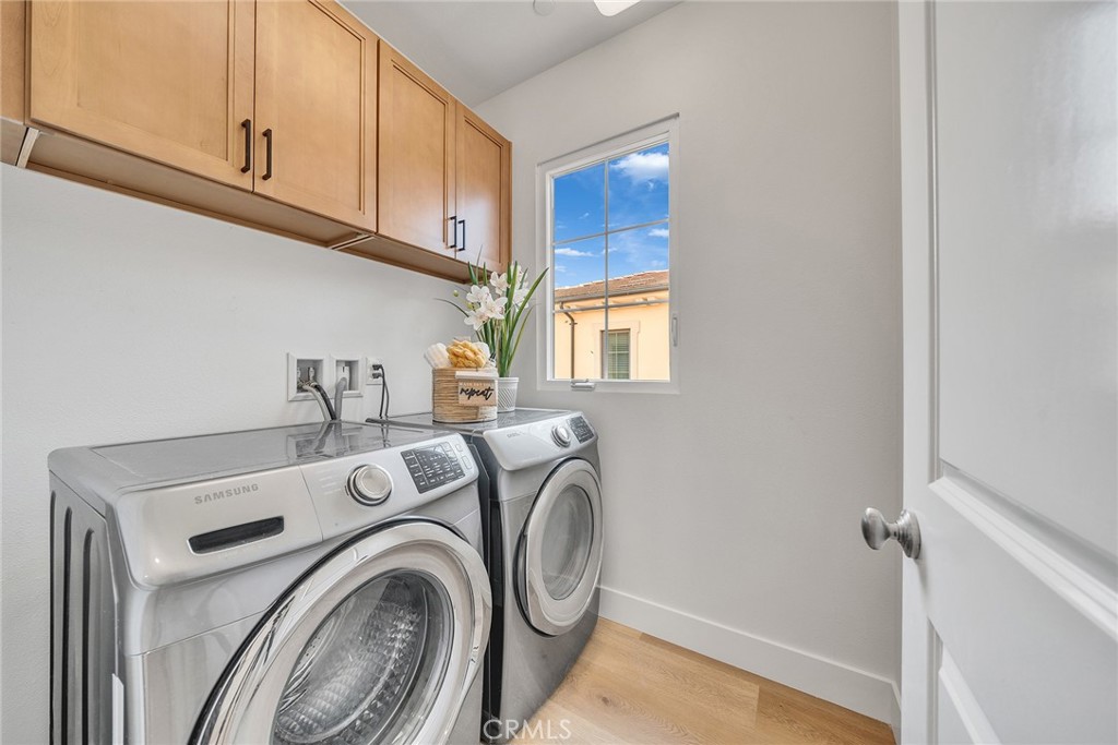 55 Open Range Irvine, CA 92602 - Photo 26 of 66 a utility room with dryer and washer