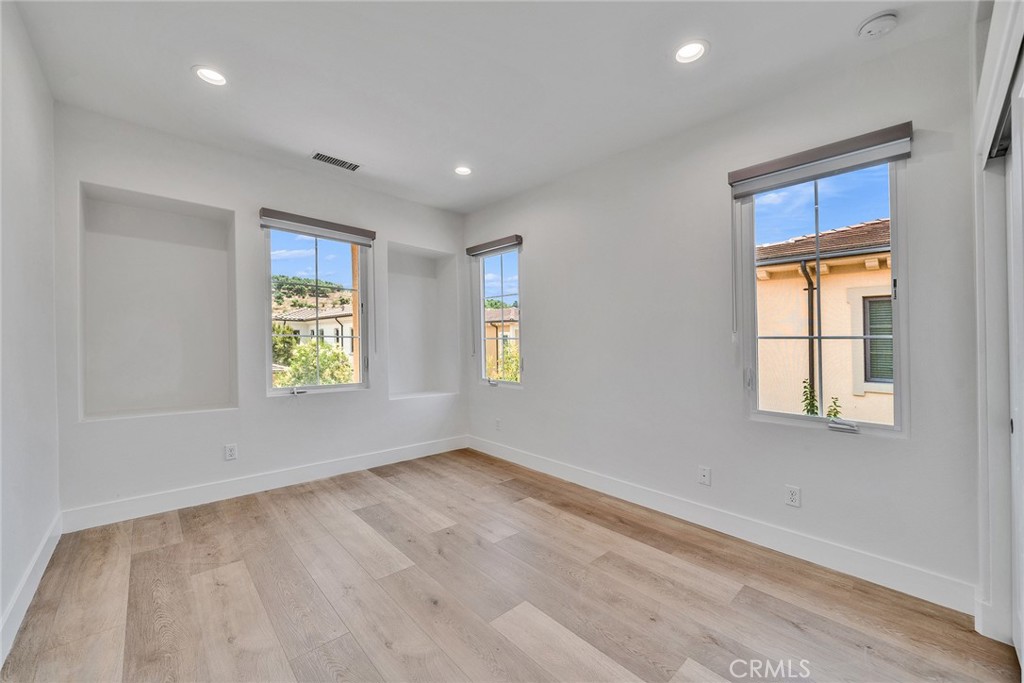55 Open Range Irvine, CA 92602 - Photo 27 of 66 an empty room with windows
