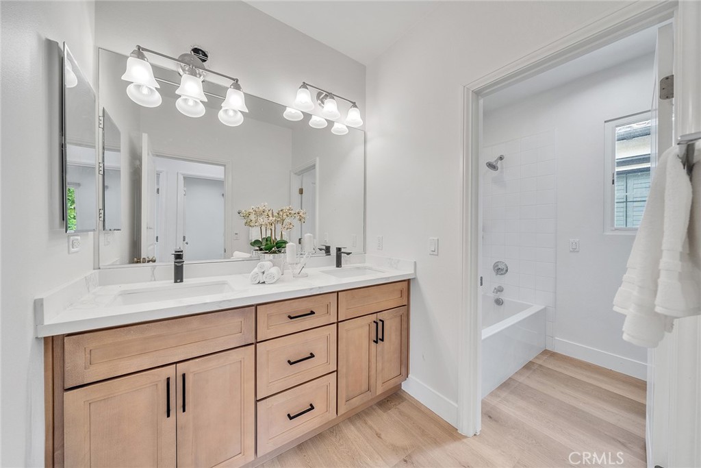 55 Open Range Irvine, CA 92602 - Photo 29 of 66 a bathroom with a sink double vanity granite tub and a mirror