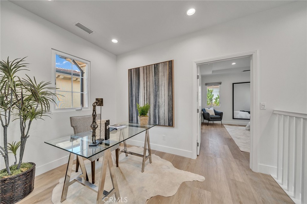 55 Open Range Irvine, CA 92602 - Photo 33 of 66 a living room with furniture and a potted plant