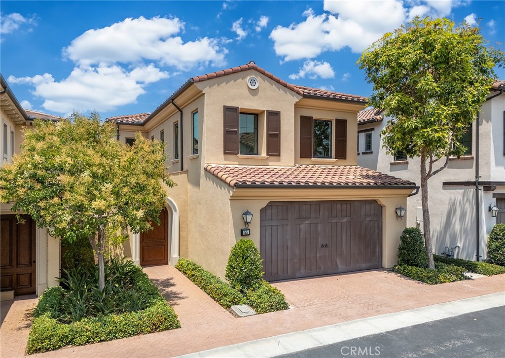 55 Open Range Irvine, CA 92602 - Photo 61 of 66 a front view of a house with a garden