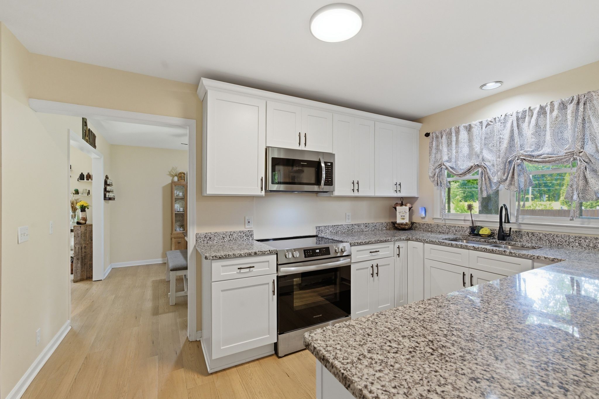 99 Smoke Rise Circle Manchester, TN 37355 - Photo 14 of 45 a kitchen with a stove a sink and a microwave