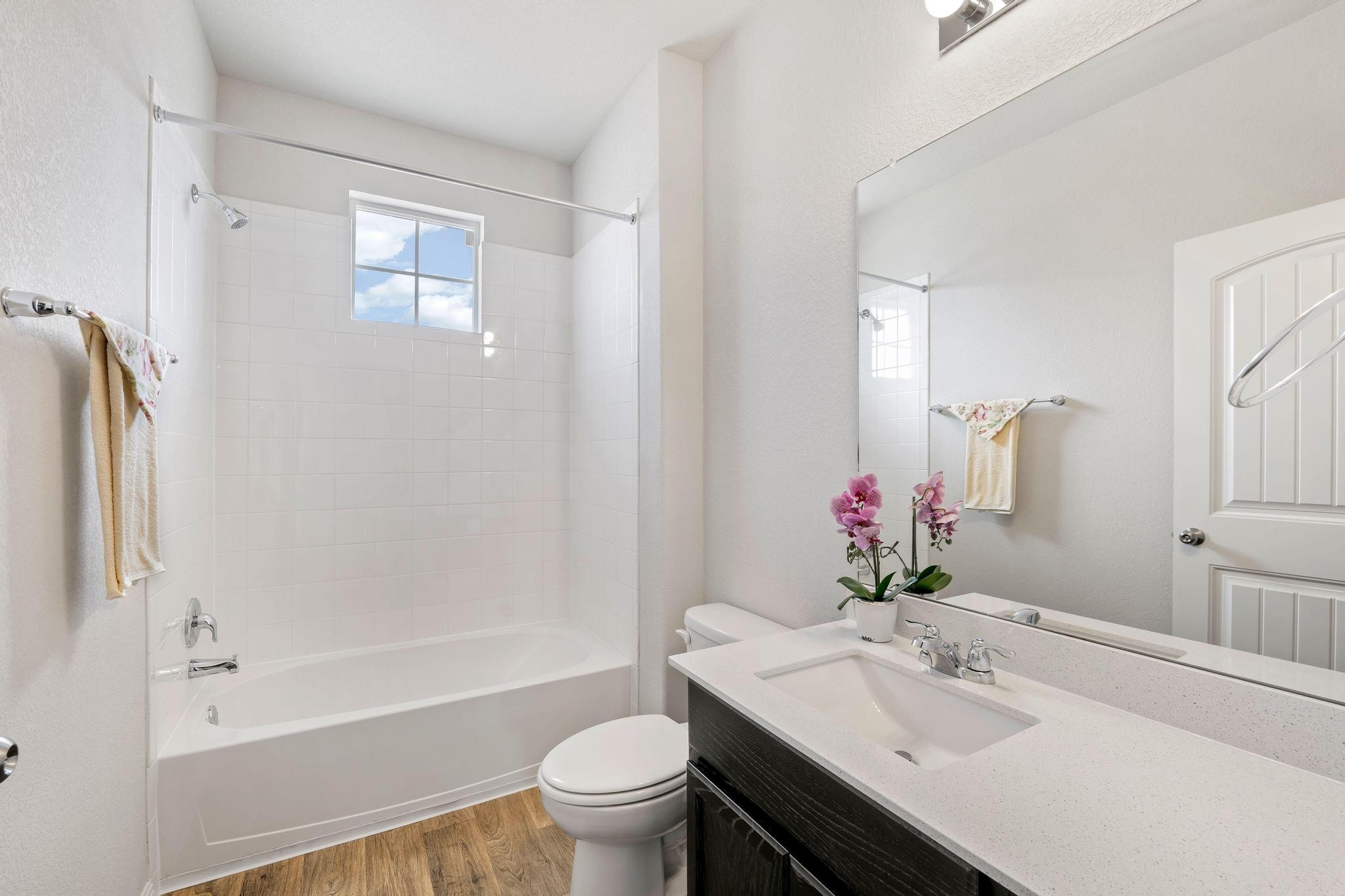 14409 Frankel Loop, Unit 33A Pflugerville, TX 78660 - Photo 21 of 29 Full bath with tub / shower combination, vanity, and light wood-style floors