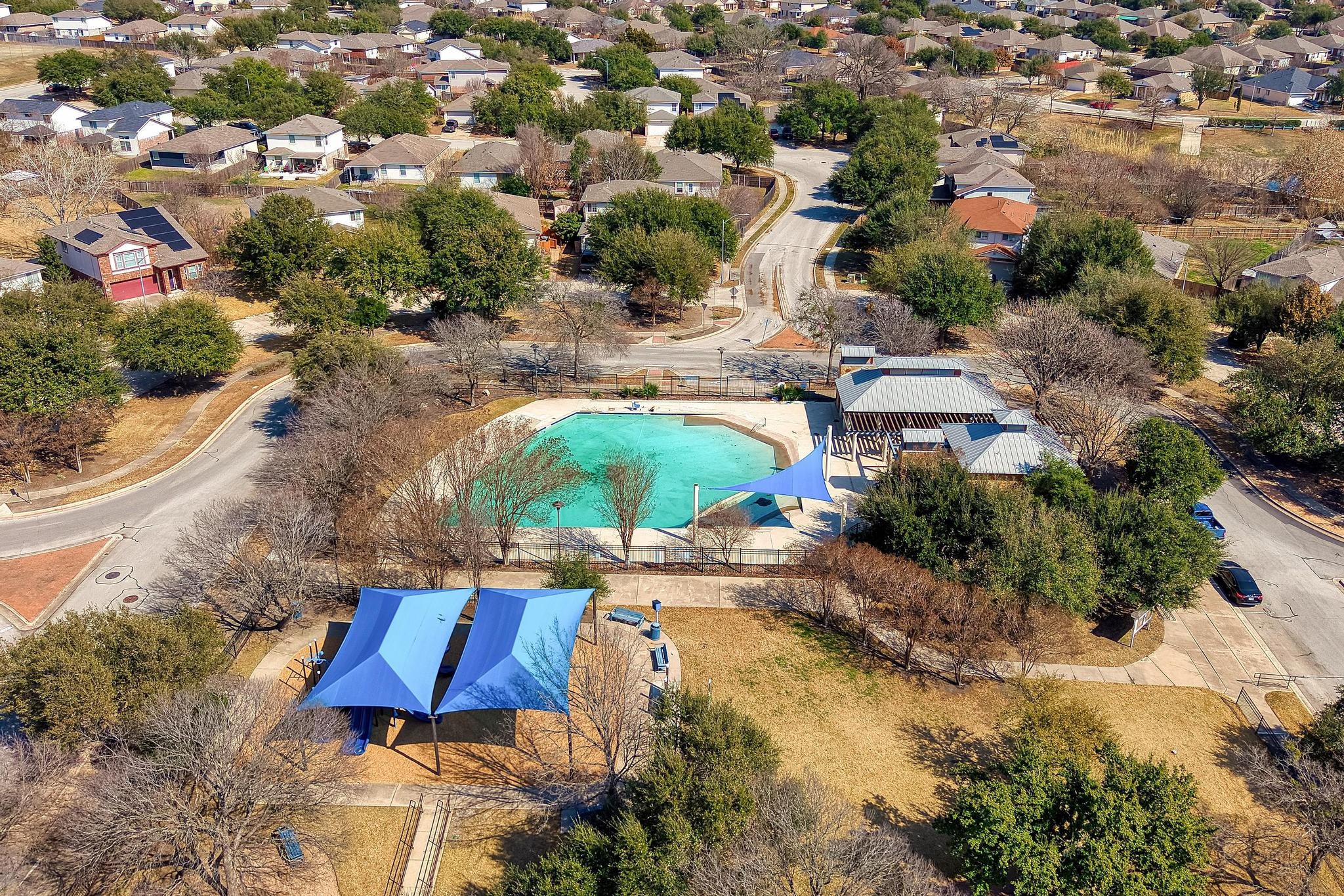 14409 Frankel Loop, Unit 33A Pflugerville, TX 78660 - Photo 26 of 29 Aerial perspective of suburban area with a pool