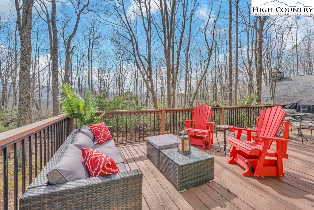 837 Pine Ridge Road Beech Mountain, NC 28604 - Photo 14 of 23 a sitting area with furniture on wooden deck