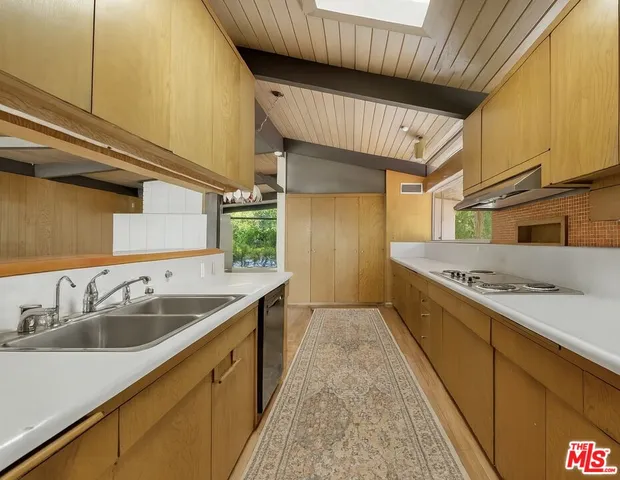 a kitchen with a sink and cabinets
