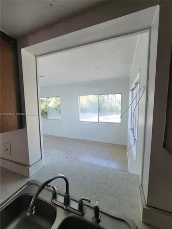 a view of an empty room and window