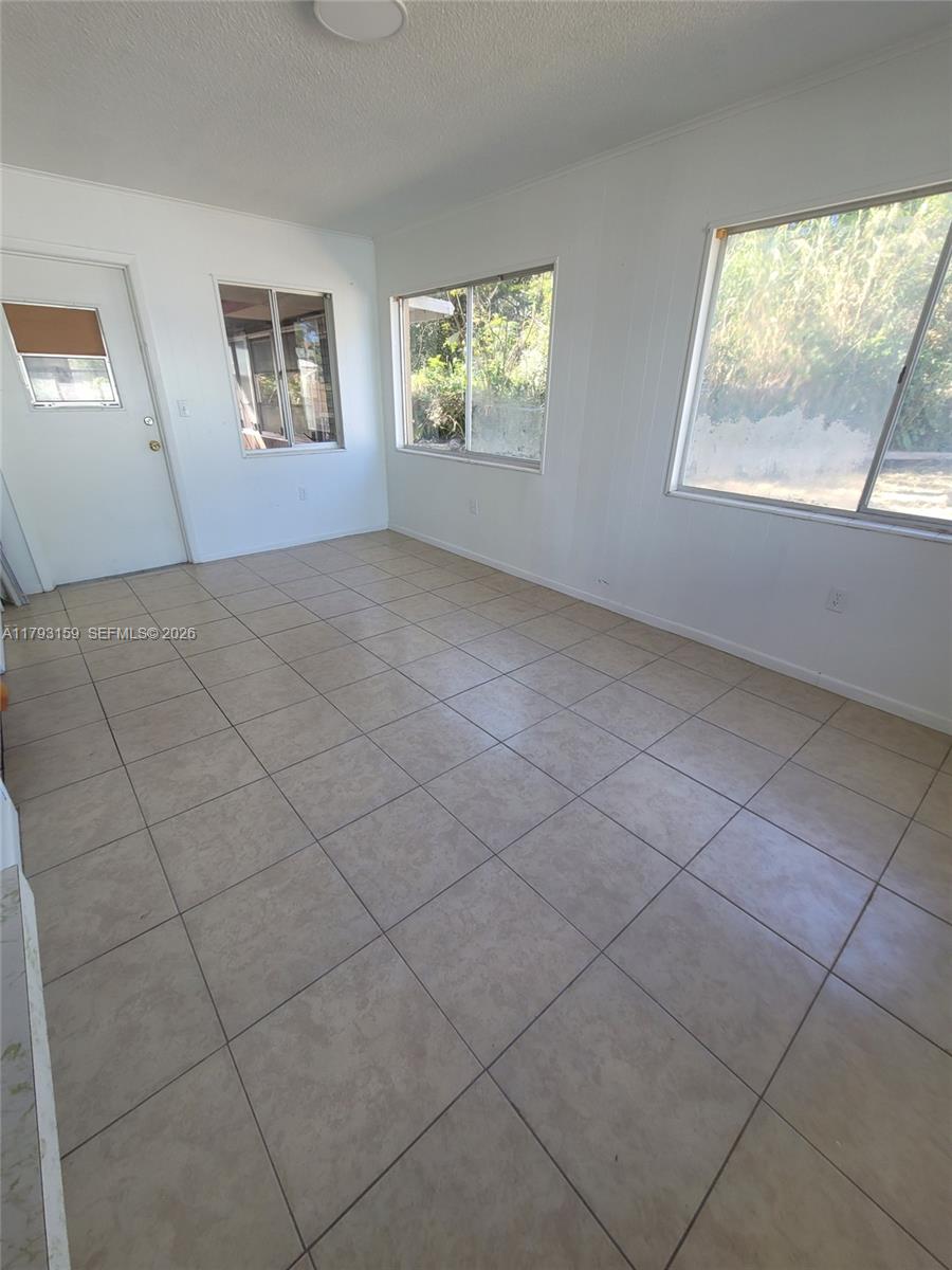 1112 Evanston Street Sebring, FL 33870 - Photo 22 of 41 an empty room with windows