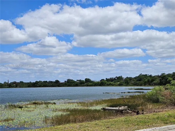 a view of lake with mountain in the back