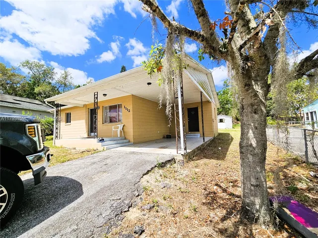 a front view of a house with a patio