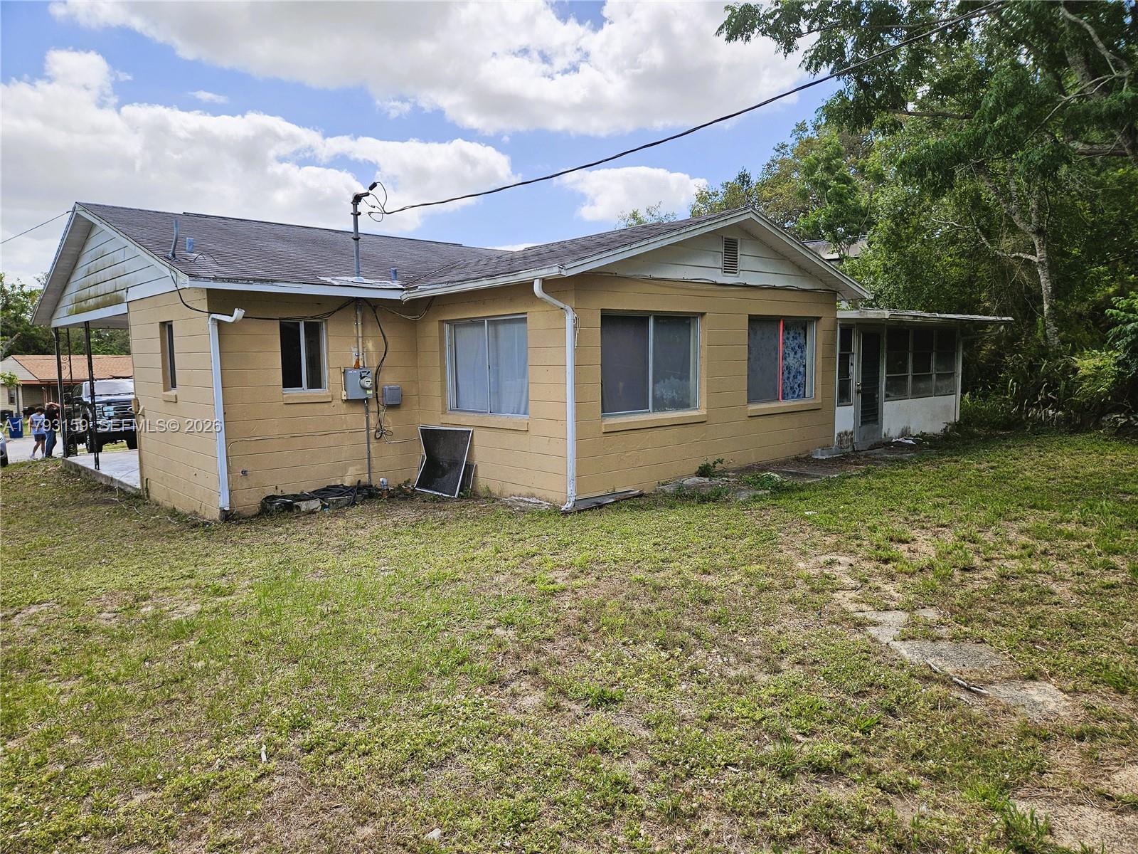 1112 Evanston Street Sebring, FL 33870 - Photo 7 of 41 front view of a house with a yard